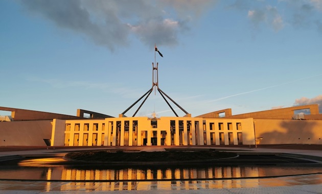 Australian Parliment building at sunset with blue skies