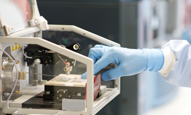 Cooperative Research Centre for Future Food Systems close up of gloved researcher hand in lab machine