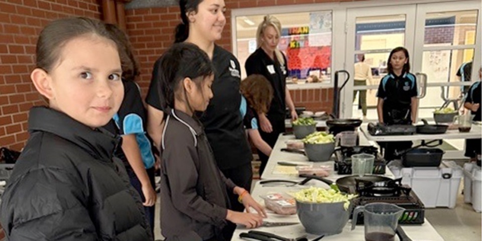 young students cooking