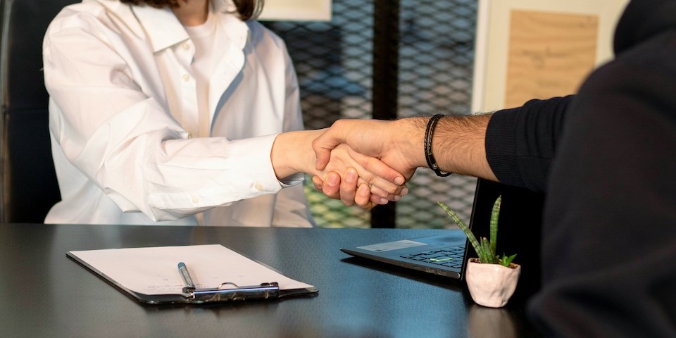 business handshake in office