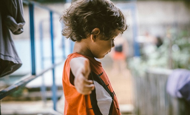 young boy stretching