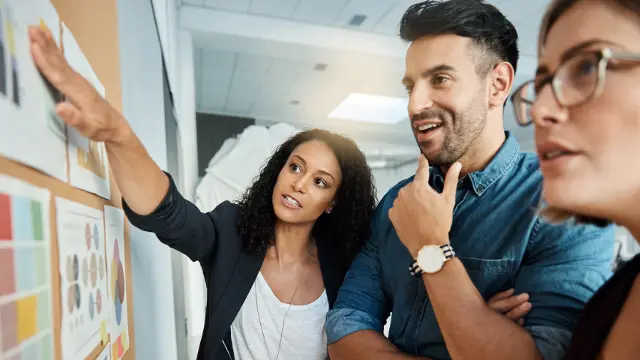 Students brainstorming using sticky notes