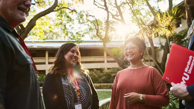 Staff chatting together at the Marion Blackwell Garden