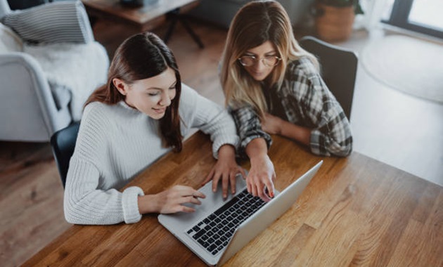 Mother and Daughter looking at laptop