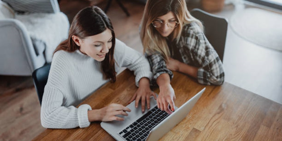 Mother and Daughter looking at laptop