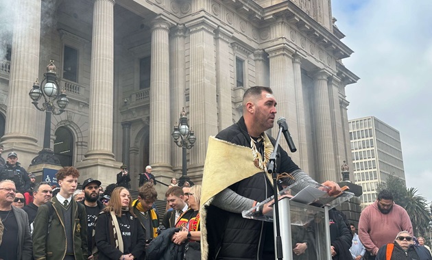 Travis Lovett at lectern