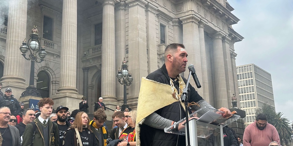 Travis Lovett at lectern