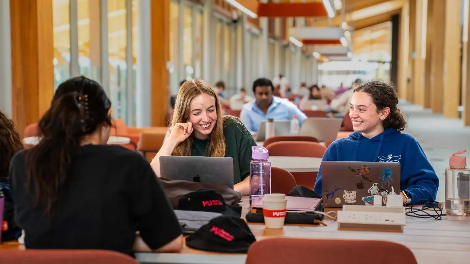 Murdoch University students on laptops in Boola Katitjin