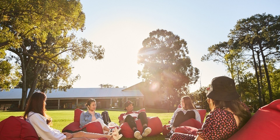 Students sitting on bean bags at Bush Court