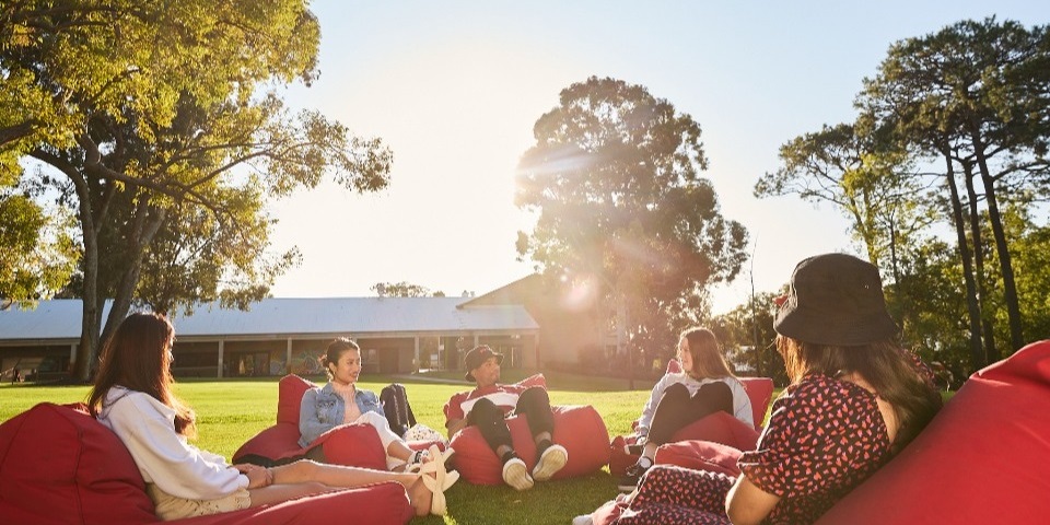 Students sitting on bean bags at Bush Court
