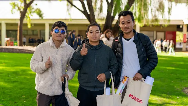 3 students posing O-Day on Bush Court