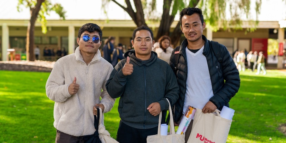 3 students posing O-Day on Bush Court