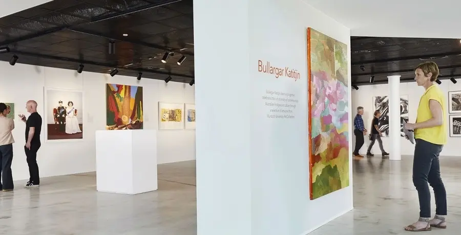 Visitors browsing art gallery