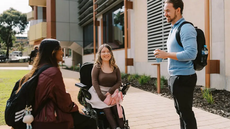 students talking to man