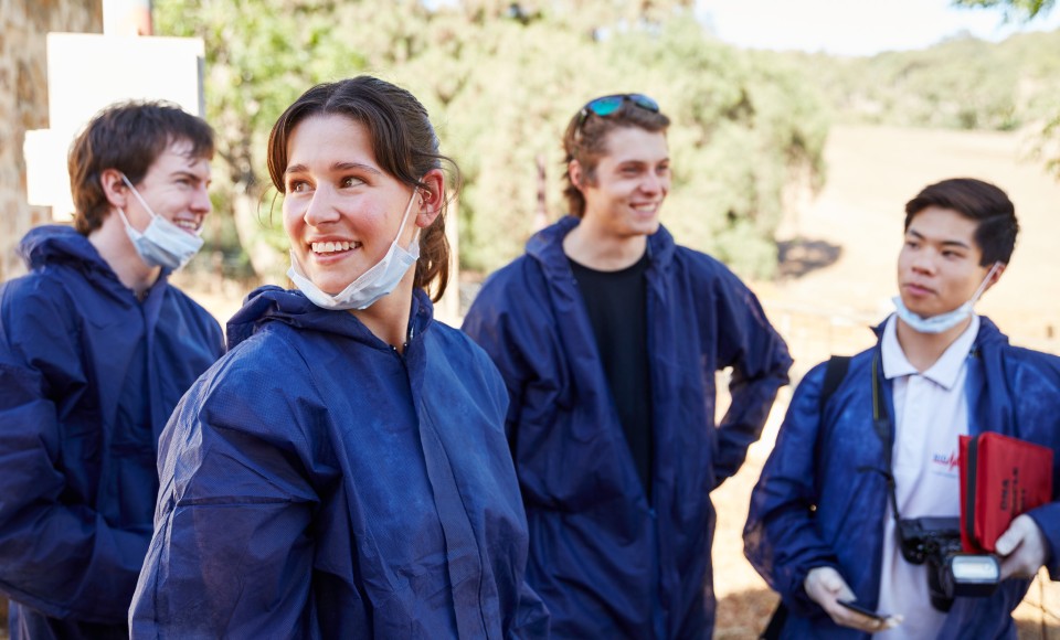 A group of forensics students socialising in the field.