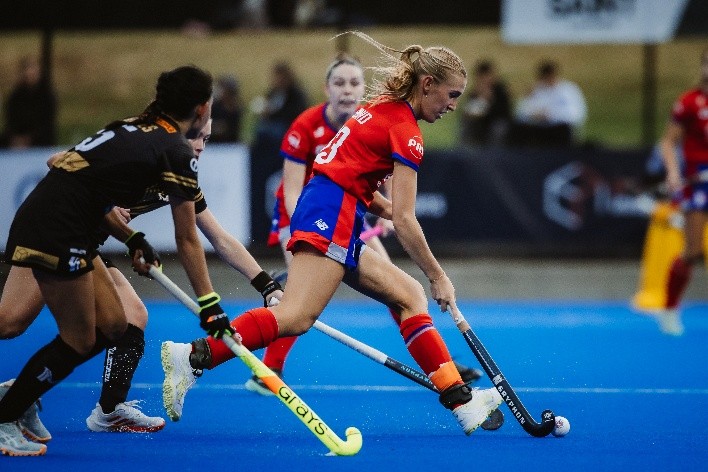 Harriet Shand playing hockey