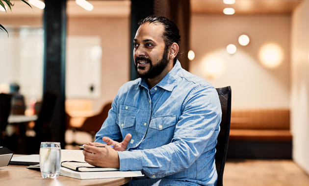 A male postgraduate business student working in the CBD office