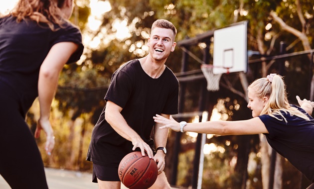 Student playing basketball