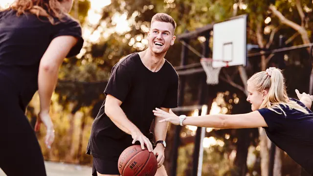 Student playing basketball