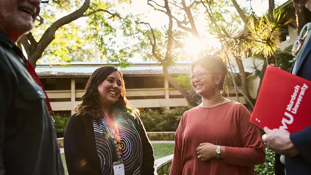 Murdoch Staff laughing together at Marion Blackwell Gardens