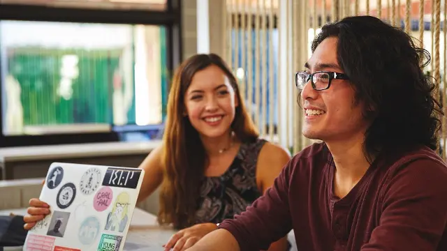 Students sat in student hub