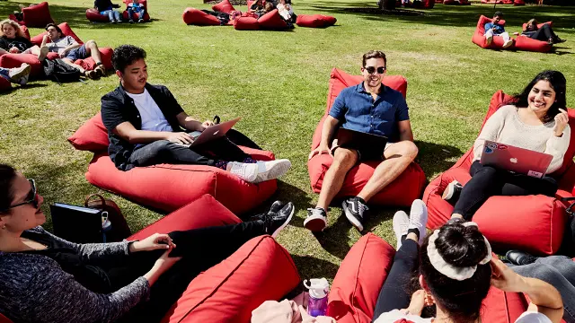 Students on bean bags sitting on Bush Court
