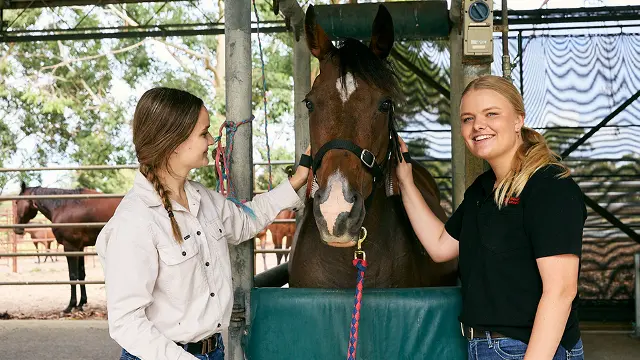 Agricultural sciences students with horse