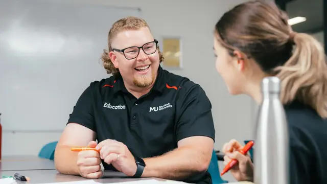 Education student in conversation with a mentor or lecturer
