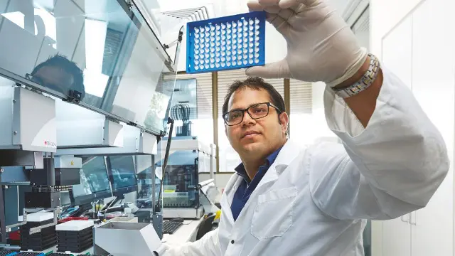 Vet Science student examining a sample in a laboratory
