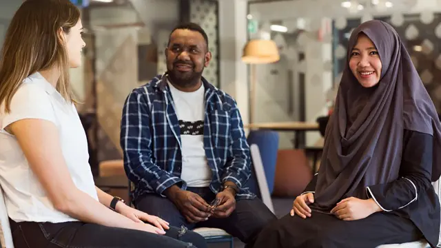 Students in conversation in a campus common area