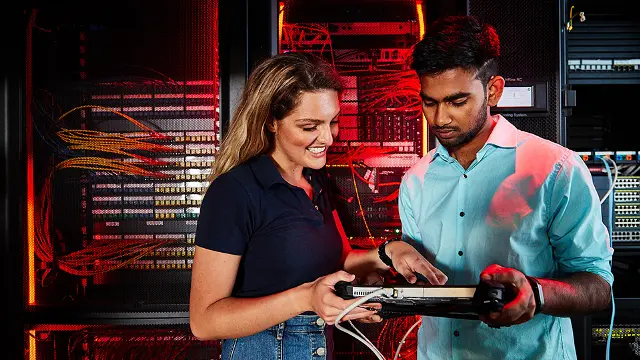 Information technology students in server room