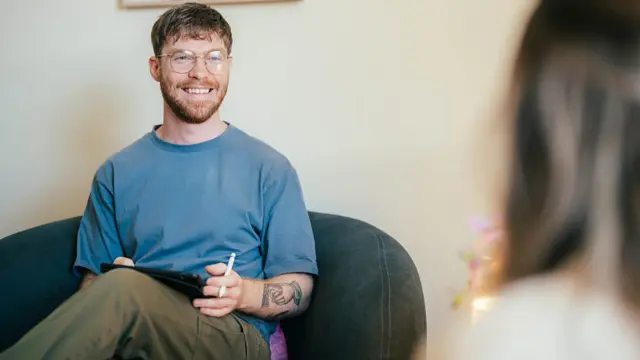 Psychology student in a counselling session with a practitioner