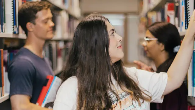 Students laughing together in Murdoch library