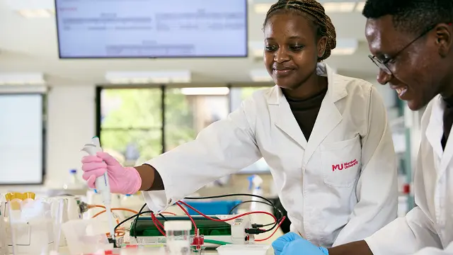 MMFS students in lab coats doing test