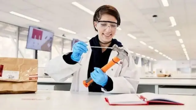 Murdoch University MMFS student with hammer prop