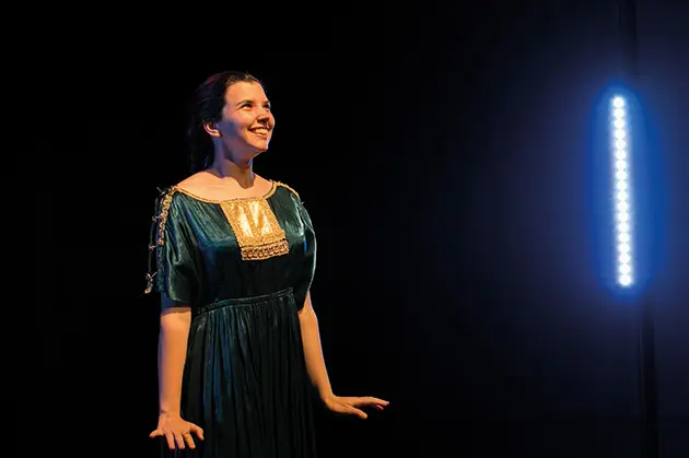 Performer on stage in costume