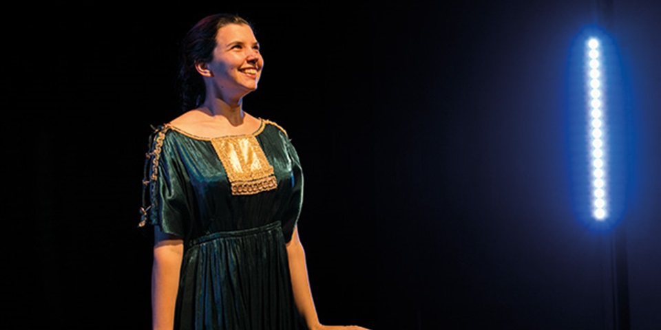 Performer on stage in costume