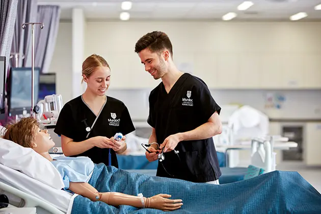 2 nursing students in practive lab