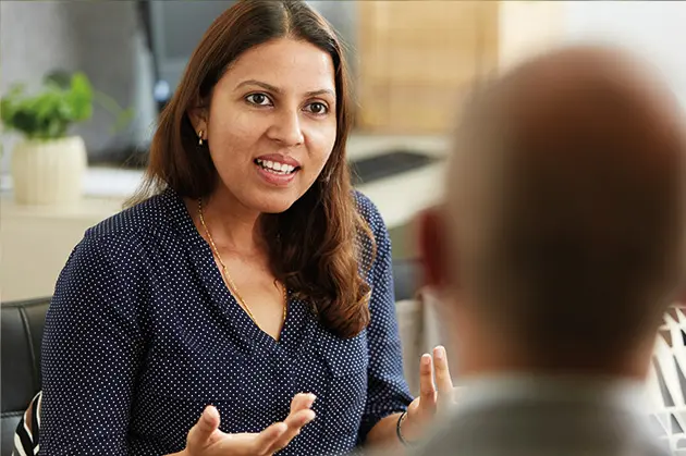 Woman speaking to a patient