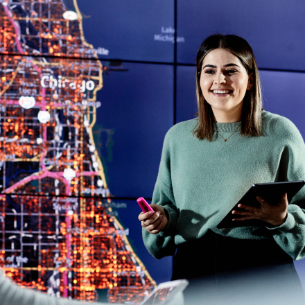 Woman infront of Digital Map