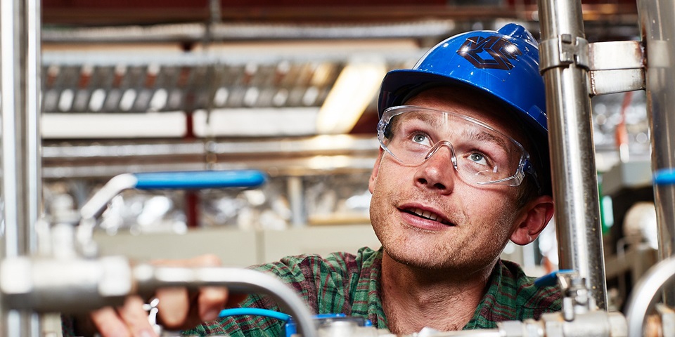 Engineer fixing working on metal pipes