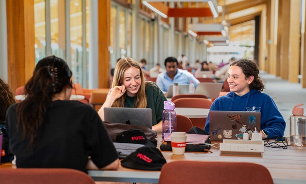 Two female Murdoch Uni students studying and socialising at BK
