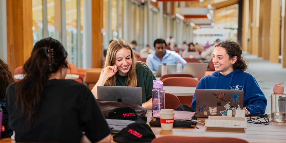 Two female Murdoch Uni students studying and socialising at BK