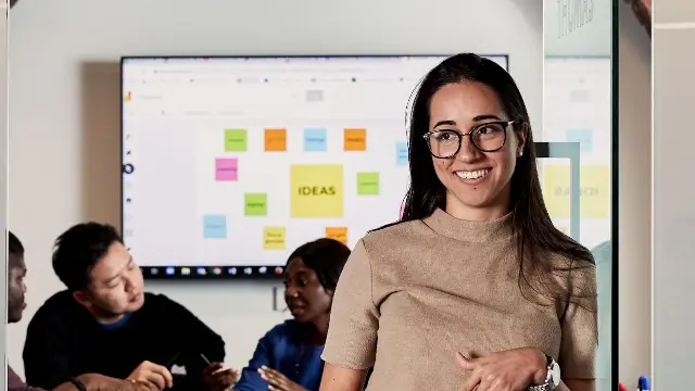 Female postgraduate student outside study room at Murdoch University