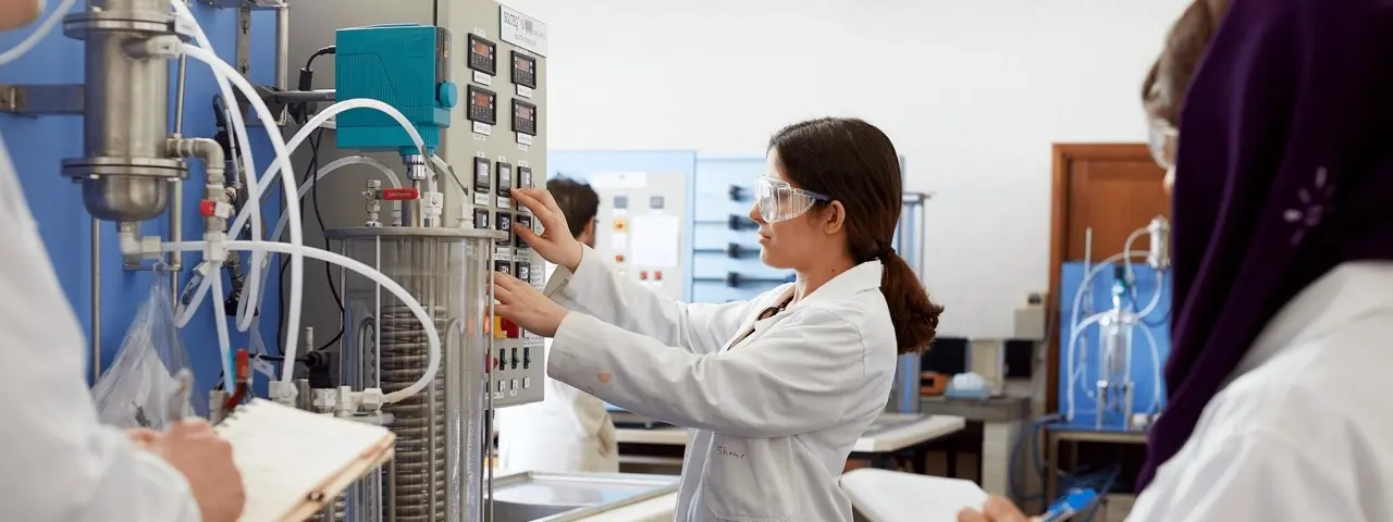 Murdoch University research student in lab using machine