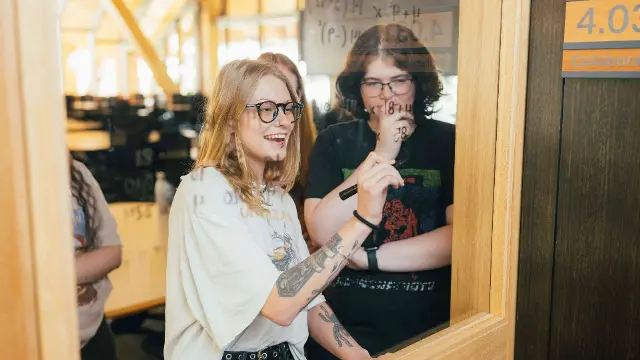 Female mathematics students working on project