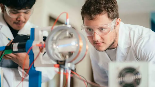 Male physics student working in the lab