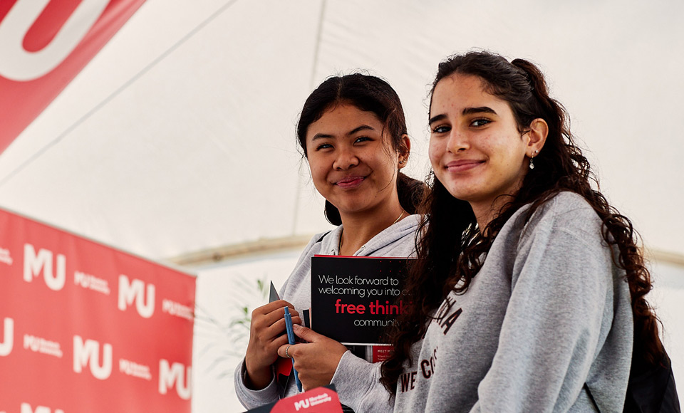 two female students smiling