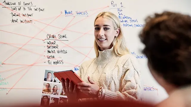 Murdoch University student infront of whiteboard
