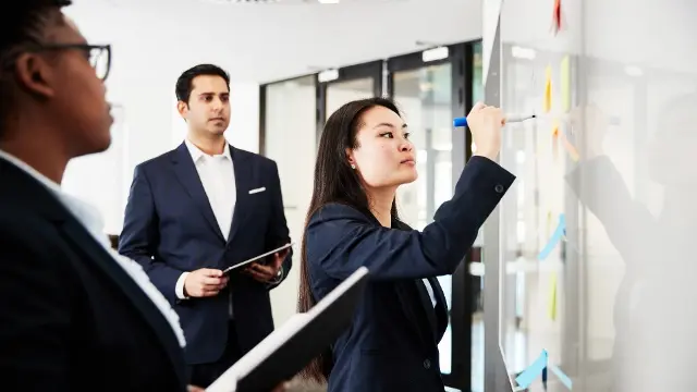 female writing on a screen